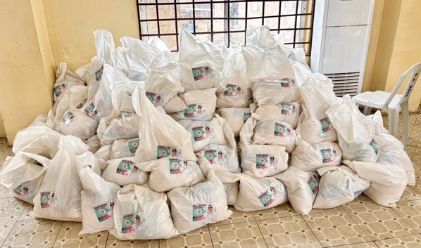 Stacks of labeled food packages prepared for widow households